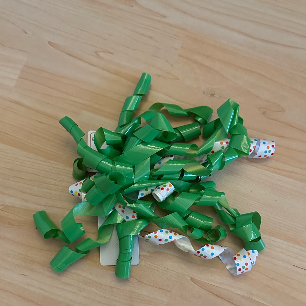 One large curled ribbon sticky bow
